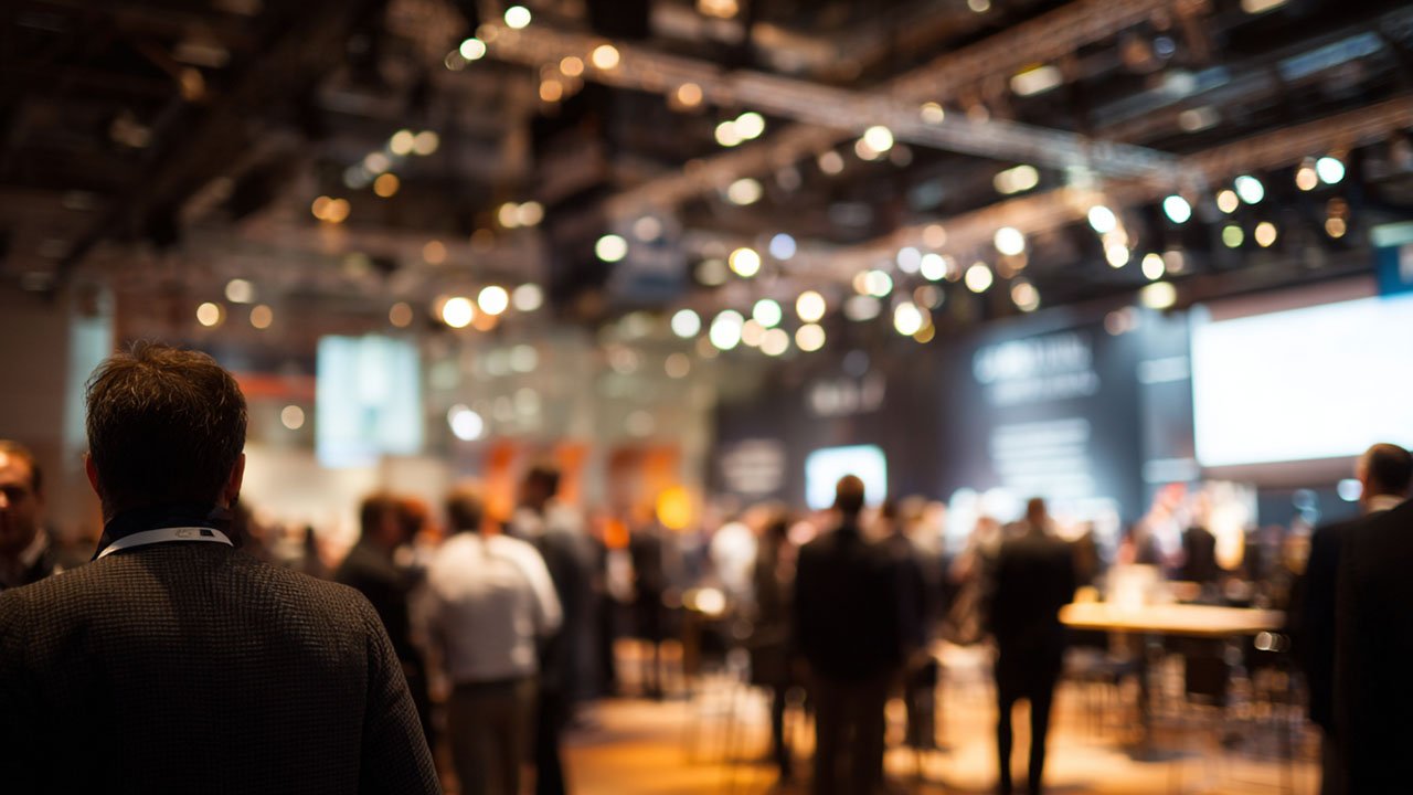 Business conference with attendees networking.