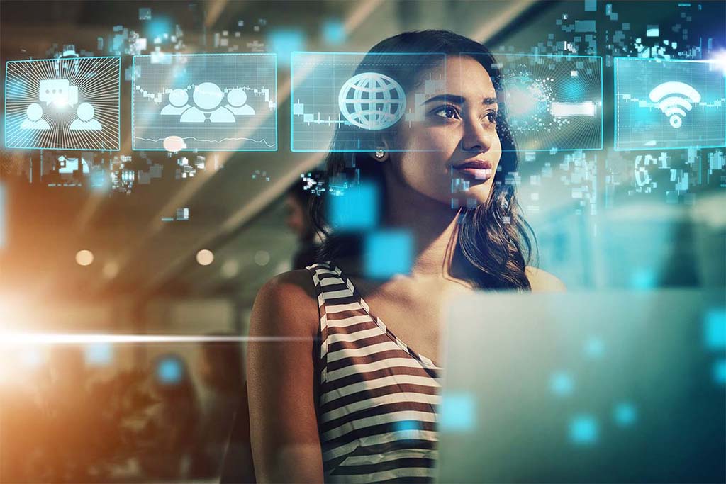 Women using AI and digital holograms in content development, showcasing tools like Articulate 360, Adobe Captivate, Vyond, Camtasia, Adobe Creative Cloud, AI, and Microsoft 365 for impactful learning design.